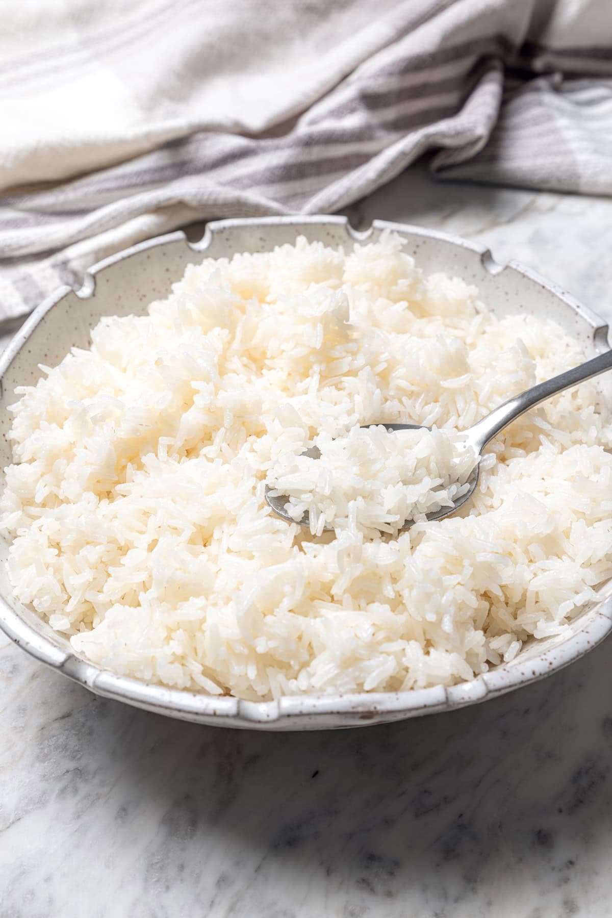 Bowl of jasmine rice with spoon