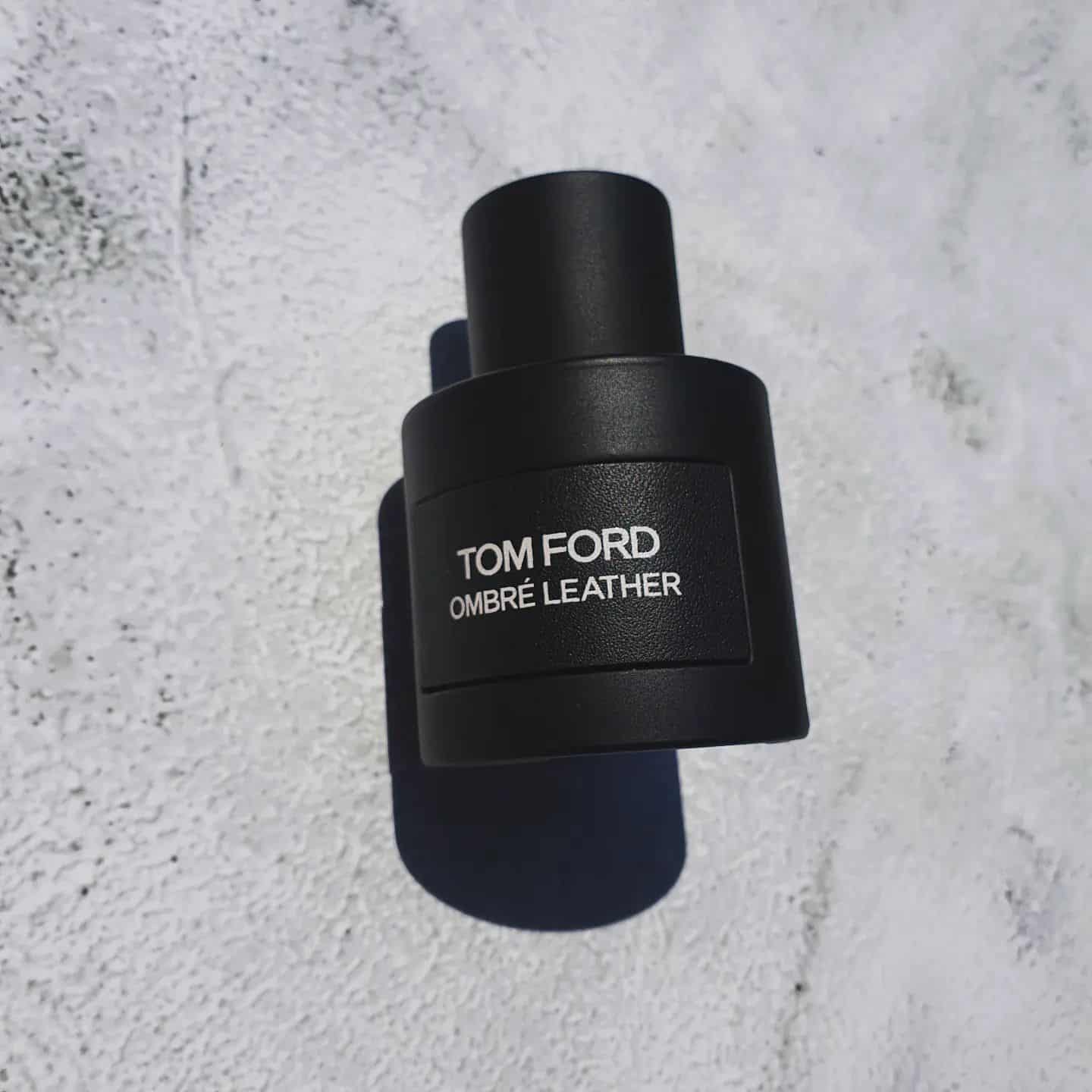 a bottle of tom ford ombre leather and its shadow