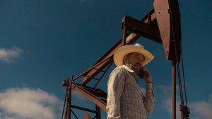 'Landman' stars Billy Bob Thornton as Tommy Norris, shown here wearing a white cowboy hat in front of an oil rig