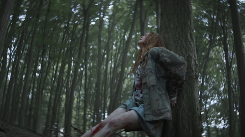 Maya running through the forest trying to survive in The Strangers - Chapter 2