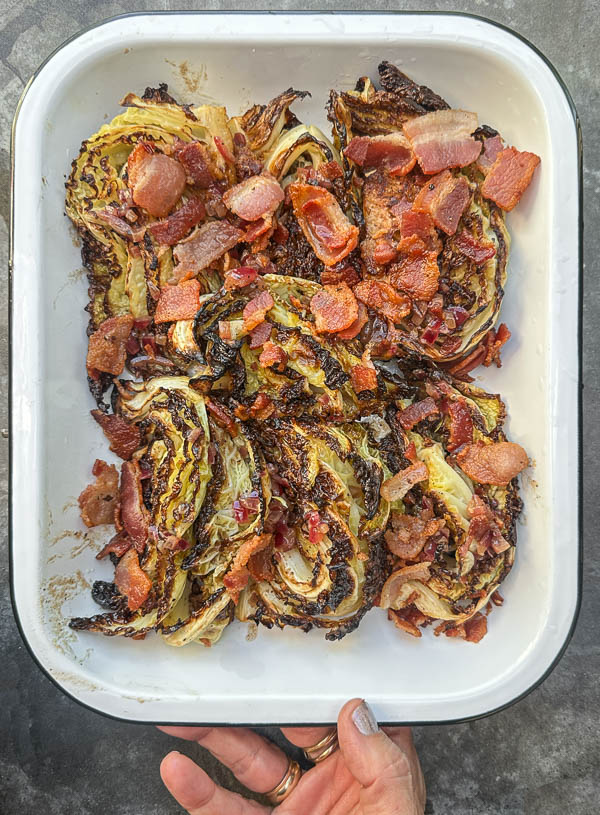 Try this Maple Bacon Cabbage recipe! Roasted cabbage wedges with crispy bacon and a homemade maple Dijon dressing. Easy, flavorful, gluten-free side dish for fall dinners, Thanksgiving, or meal prep. #vegetableside #cabbagerecipes #shutterbean