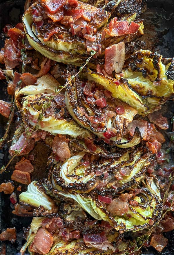 Try this Maple Bacon Cabbage recipe! Roasted cabbage wedges with crispy bacon and a homemade maple Dijon dressing. Easy, flavorful, gluten-free side dish for fall dinners, Thanksgiving, or meal prep. #vegetableside #cabbagerecipes #shutterbean