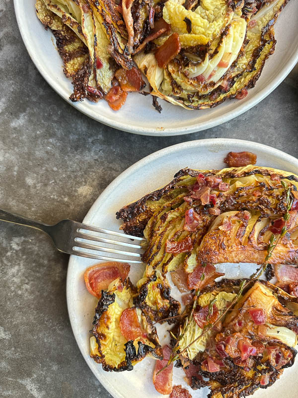 Try this Maple Bacon Cabbage recipe! Roasted cabbage wedges with crispy bacon and a homemade maple Dijon dressing. Easy, flavorful, gluten-free side dish for fall dinners, Thanksgiving, or meal prep. #vegetableside #cabbagerecipes #shutterbean