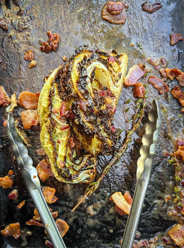 Try this Maple Bacon Cabbage recipe! Roasted cabbage wedges with crispy bacon and a homemade maple Dijon dressing. Easy, flavorful, gluten-free side dish for fall dinners, Thanksgiving, or meal prep. #vegetableside #cabbagerecipes #shutterbean