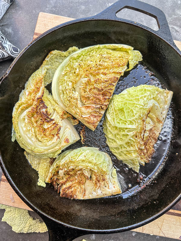 Try this Maple Bacon Cabbage recipe! Roasted cabbage wedges with crispy bacon and a homemade maple Dijon dressing. Easy, flavorful, gluten-free side dish for fall dinners, Thanksgiving, or meal prep. #vegetableside #cabbagerecipes #shutterbean
