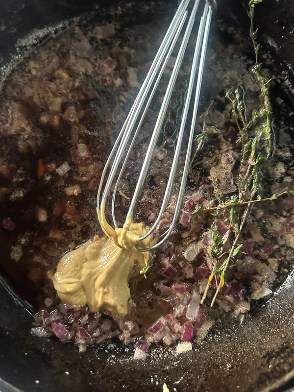 Try this Maple Bacon Cabbage recipe! Roasted cabbage wedges with crispy bacon and a homemade maple Dijon dressing. Easy, flavorful, gluten-free side dish for fall dinners, Thanksgiving, or meal prep. #vegetableside #cabbagerecipes #shutterbean