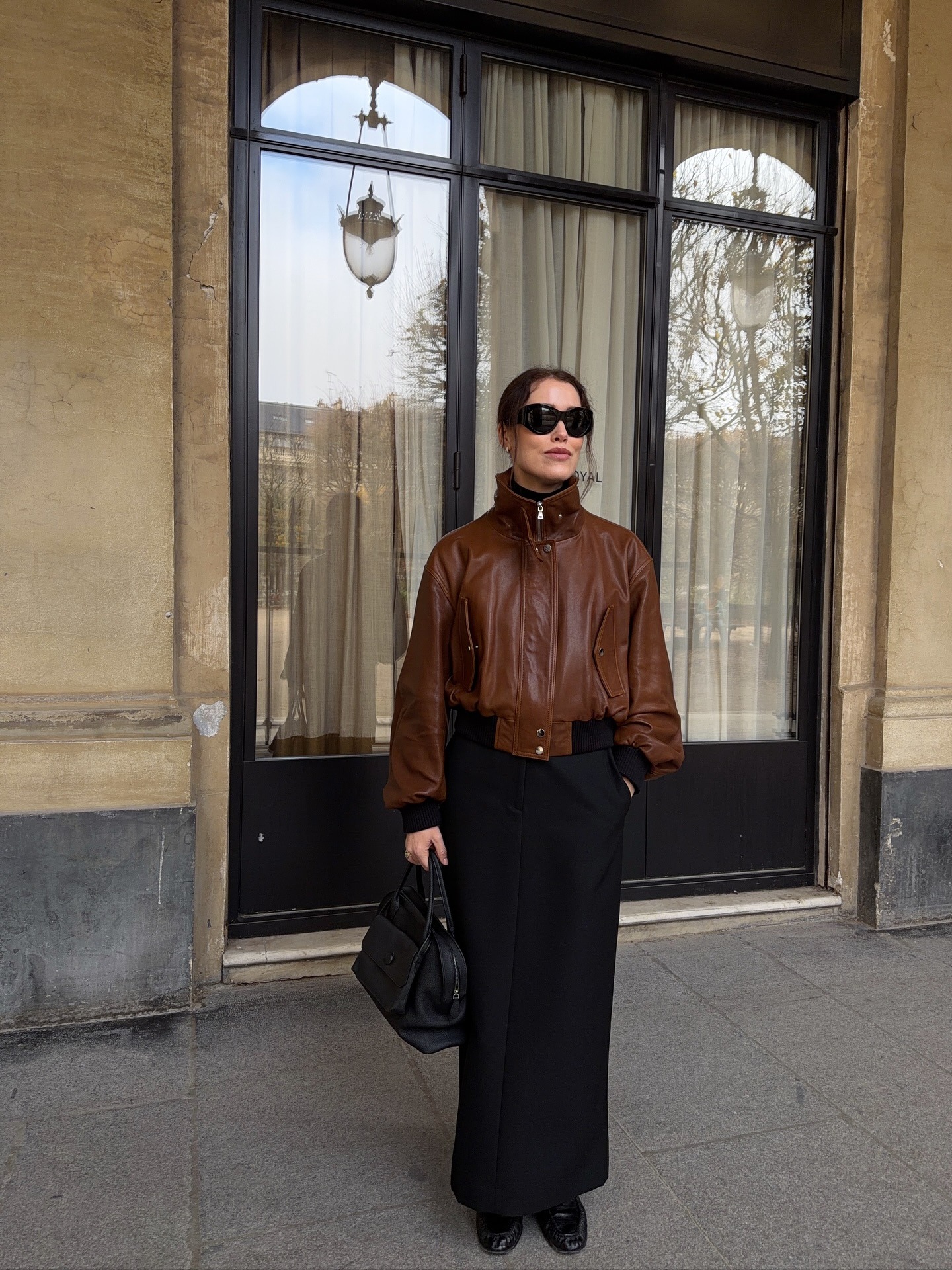 Annabel Rosendahl wearing a skirt outfit idea for 2026, including a maxi skirt with a leather bomber jacket.