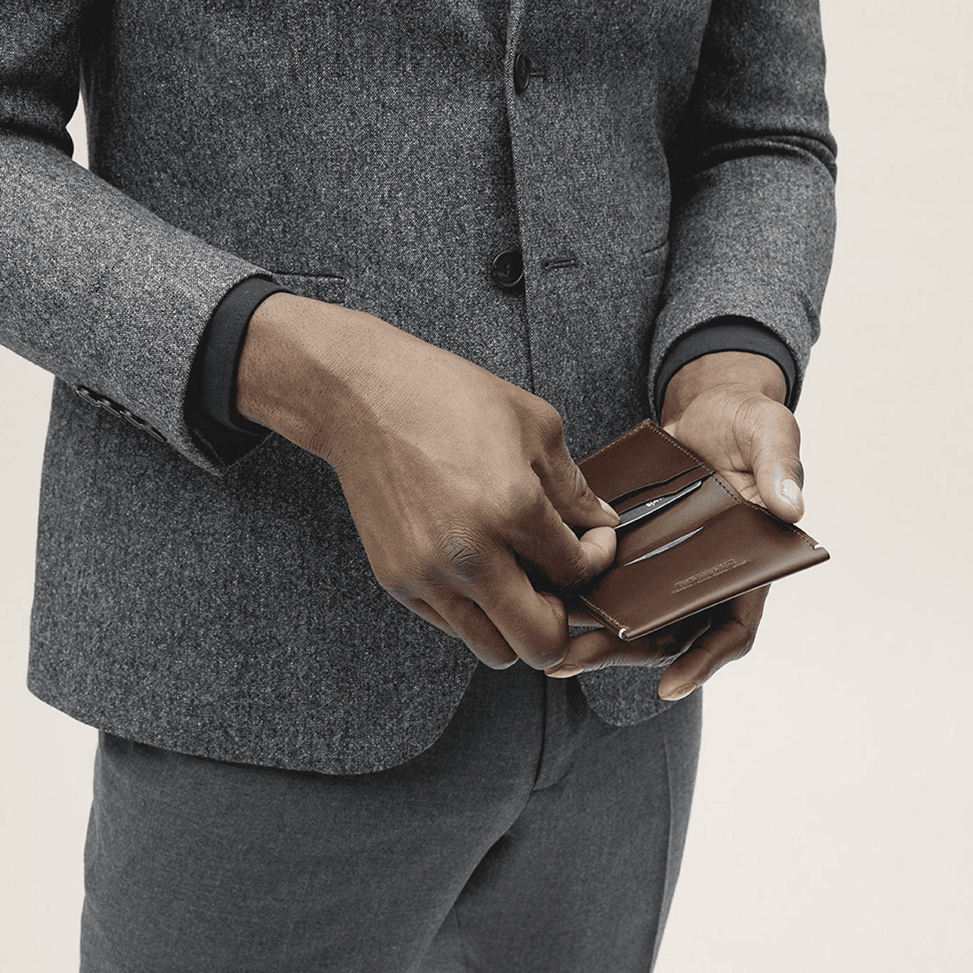 Man holding bifold wallet